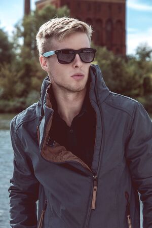 Fashion outdoor photo of stylish handsome manの写真素材