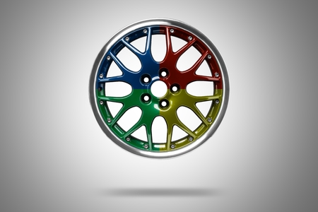 Colorful alloy rims floating in the air at gray backgroundの写真素材