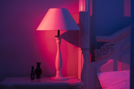 Art Deco Stylish bedroom lamp standing at white tableの写真素材