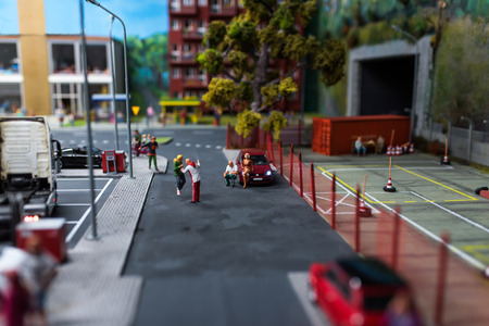 Close up of Miniature World, hooligan beats a man at the parkingの写真素材