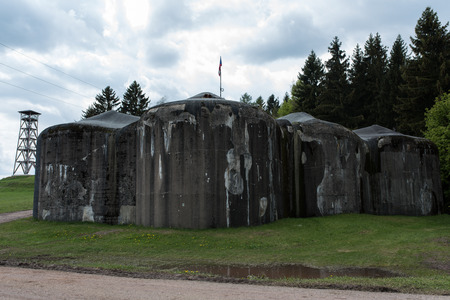 A World War Two concrete Old german bunker with electric poles in background in Czech republic