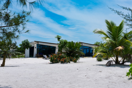 Beautiful white modern concrete bungalow with blue mirrored windows on the tropical island beach have been handed for use in september 2017. Koh Rong Island, Cambodia Asia.のeditorial素材