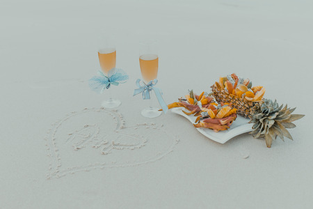Glasses with champagne on the beachの写真素材