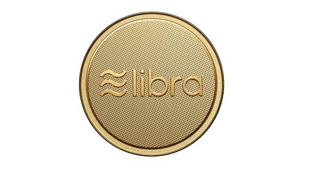 Concept of golden Libra coin with logo on front. New project of digital crypto currency payment. 3D render Coin placed on a white background.の写真素材