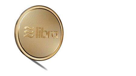 Concept of golden Libra coin with logo on front. New project of digital crypto currency payment. 3D render Coin placed on a white background.の写真素材