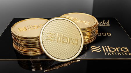 View of Libra black credit card GOLD and golden Libra coins placed on a black background. Project Libra conceptual design. 3D renderの写真素材