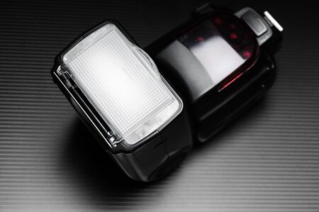 External flash lamp for dslr camera on the dark background.の写真素材