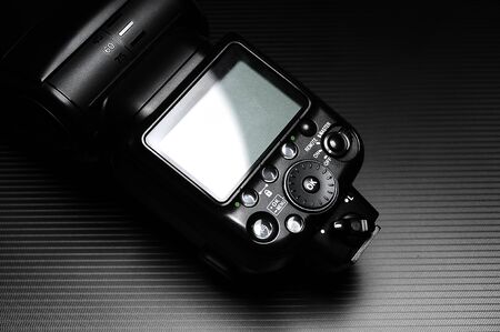 External flash lamp for dslr camera on the dark background.の写真素材