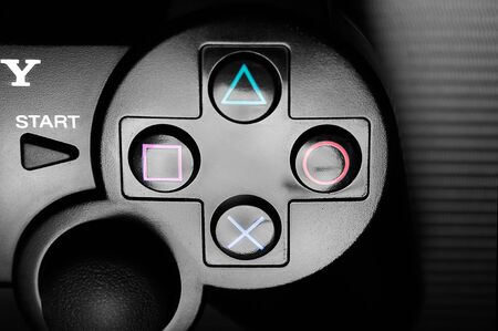 DualShock 3 wireless controller, a gamepad for the PlayStation 3, a home video game console produced by Sony Computer Entertainment, on dark background. Wroc?aw, 16 February 2012, Poland.のeditorial素材