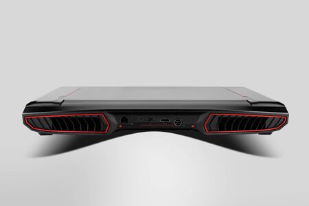 Photography of gaming laptop from the back side, placed on gray background. Laptop designed for gamers or professional players or 3d renderingの写真素材