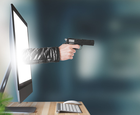 Hand with gun leaves the monitor, threats or violence