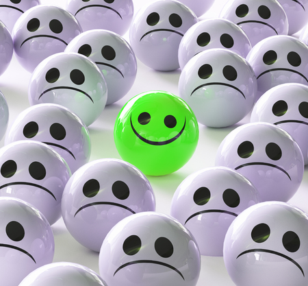 Happy face of sad, stand, different from the massesの写真素材