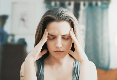 Woman with headache, stressful, pain or thinkの写真素材