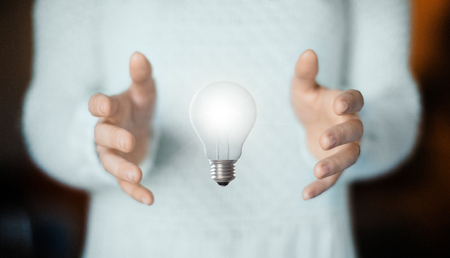 Lightbulb on hand, concept of ideaの写真素材