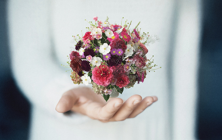 Bouquet on hand, flowers, bride, springの写真素材