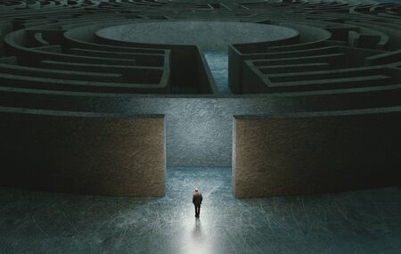 Businessman standing in front of the entrance to the maze. 3d renderingの写真素材