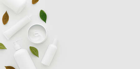Natural organic SPA cosmetic products set with green leaves. Top view herbal skincare beauty...