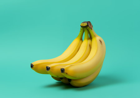 Bunch of bananas isolated on blue background. 3d render.の素材