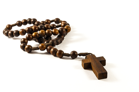 Wood rosary and cross with isolated backgroundの写真素材