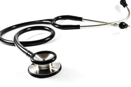 The black color stethoscope on white backgroundの写真素材