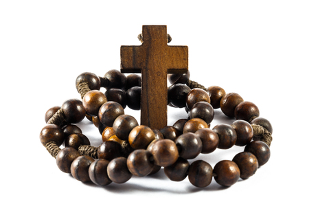 Wood rosary and cross with isolated backgroundの写真素材