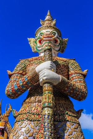 The statue of giant hold club and blue sky in Wat Phra Kaew ,Thailand   Antの写真素材