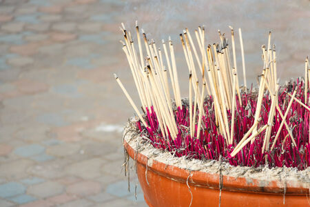 Joss stick pot and blank area at left sideの写真素材