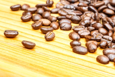 close up of coffee beans on wooden tableの写真素材