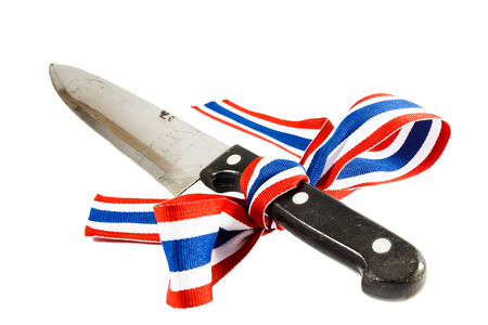 Symbol of Corruption and violence in Thailand (Dirty knife was binded by thai flag ribbon)の写真素材