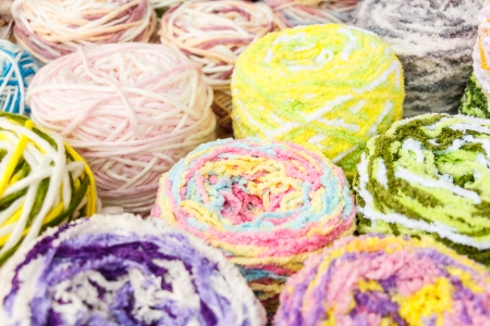 close up to group of colorful knitting woolの写真素材
