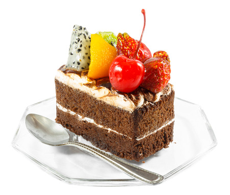 fruitcake and spoon on whiteの写真素材