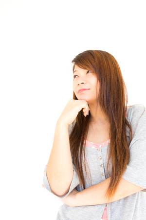 asian woman is thinking to something  blank area at left side for fill something のeditorial素材