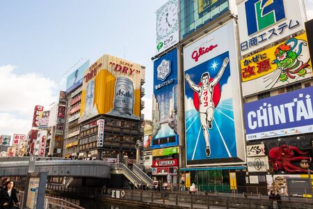 OSAKA , JAPAN - February 1, 2019 : Minami Namba and Shinsaibashi . Dotonbori area with many advertisement billboard on building such as Glico running man sign at daytime .のeditorial素材