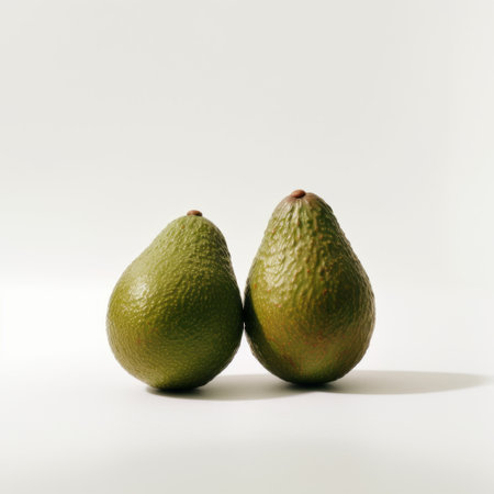 green avocados, captured in a sculpture-based photography style, showcase the beauty of japanese minimalism and classic still-life. this high-quality, colorized photo features australian tonalism and a white background, making the two avocados the focal point. the unique addition of duckcore adds a touch of whimsy to this stunning image. ai generatedの素材