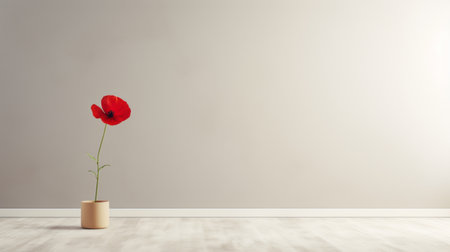 a red flower in a vase stands elegantly against a white wall and hardwood floor. the minimalist background, with its light gray and light beige tones, creates a serene atmosphere. this photo captures the essence of minimalist stage designs, reminiscent of the works of rene magritte and life-sized installations. the earth tone color palette adds a touch of warmth to the overall composition. ai generatedの素材