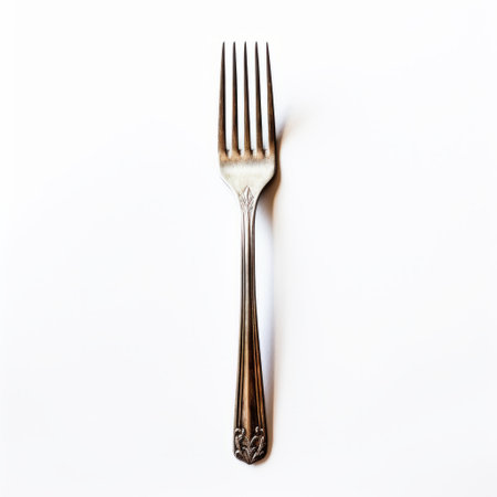 a silver-tipped fork, reminiscent of william eggleston's style, is captured in this stock photo. isolated on a white background, the fork exudes an ornate complexity, reminiscent of fine art nouveau. the image, inspired by alec soth's work, presents a classic still-life composition that is thought-provoking and showcases unpolished authenticity. ai generatedの素材