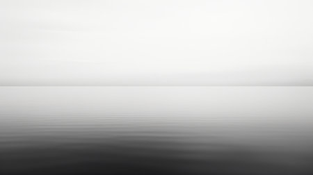 a sailboat gracefully glides across the calm waters, captured in a monochromatic minimalist portrait. this futuristic minimalism and stark black and white photography style evoke a sense of quiet contemplation. the image showcases minimalist figuration and is presented in ultra-high definition (uhd), allowing for a detailed and immersive viewing experience. ai generatedの素材