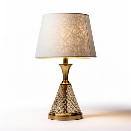a gold lampshade lamp with a realistic and detailed rendering is showcased in this uhd image. the lampshade features a combination of light beige and light amber hues, creating a traditional and elegant look. the crosshatched shading adds depth and texture to the lamp, while the clear and crisp details bring the tableau to life. ai generatedの素材