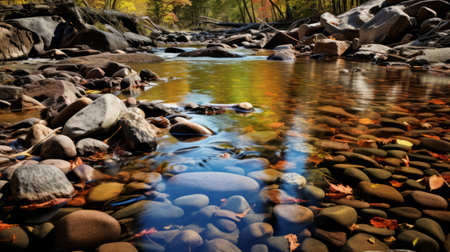 river with rocks: a stunning nature-inspired photograph by mike campau captures the beauty of a river adorned with rocks. the image showcases a mesmerizing blend of light amber and orange hues, reminiscent of the vibrant colors found in the works of gifford beal. through the use of a wide-angle lens, campau skillfully creates reflex reflections, adding depth and intrigue to this captivating piece of newの素材
