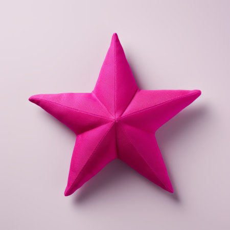 a pink star-shaped pillow is showcased on a bright white background, resembling sculptural paper constructions. the image is captured using focus stacking technique with a fujifilm xf 56mm f1.2 r lens. the pillow stands out with its bold and vibrant primary colors, particularly the dark magenta shade. the overall aesthetic exudes an elegantly formal vibe, inspired by japanese traditional elements. ai generatedの素材