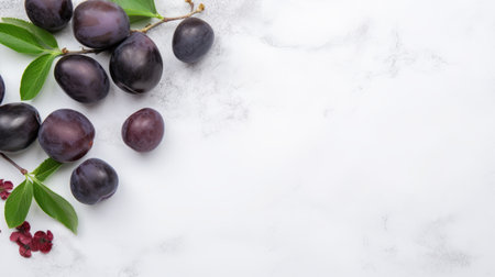 plums in various shades of purple, red, and green are arranged on a sleek marble surface. the composition follows a minimalist style, with a light purple and dark navy backdrop. the use of naturalistic materials, such as marble and raw materials, adds to the minimalist aesthetic. the plums stand out against the white background, creating a visually striking image. ai generatedの素材