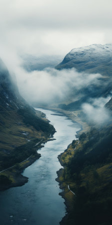 clouds surround the river, creating a stunning norwegian nature scene. the atmospheric imagery captures the juxtaposition of hard and soft lines, while the adventure pulp style adds an element of excitement. the atmospheric and moody lighting enhances the sense of nature's wonder. this photo, created using terragen, showcases the beauty of the natural world. ai generatedの素材