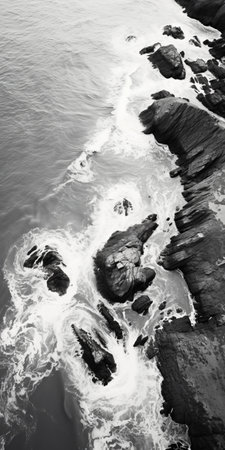 a black and white aerial view photo captures the distorted yet detailed waves at the coast. the image showcases the unique style of the pont-aven school, with saturated pigment pools and a hasselblad 1600f camera. the crystalline and geological forms add an intriguing element to this captivating composition. ai generatedの素材