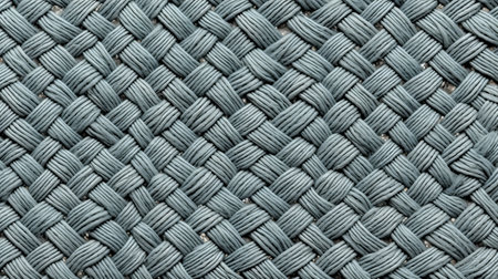 a close-up photo of a green yarn woven in a dark gray, matte style. the yarn has a light turquoise hue and is reminiscent of gustave caillebotte's artwork. this intricate piece showcases traditional craftsmanship and is made of rubber with aluminum accents. ai generatedの素材