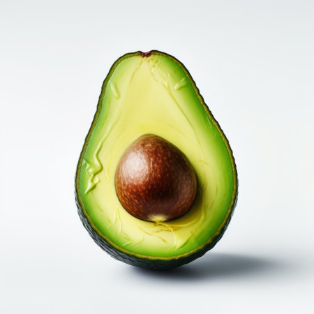 sliced avocado, perfectly ripe and ready to eat, is showcased on a clean white background. this minimal retouching style enhances the hyper-realistic portraiture of the avocado. the high-resolution uhd image captures every detail, making it ideal for use by the associated press. the photo also features elements like cross processing, text, and emoji installations, adding a unique touch to the composition. ai generatedの素材