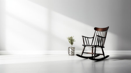 rocking chair in a minimalistic room, showcasing minimalist furniture for interior designs. the image captures the realistic portrayal of light and shadow, with a serene atmosphere. shot in uhd quality, the background is kept minimalistic. the black and gray color scheme adds to the overall aesthetic. this stunning photograph is by alson skinner clark, taken with fujifilm pro 400h film. ai generatedの素材