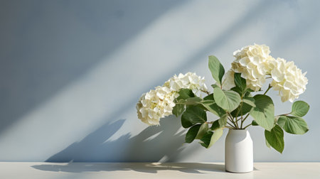 white flowers in a vase on a table, with a juxtaposition of light and shadow. the minimalist background and photorealistic rendering create a serene atmosphere. this high-quality uhd image, captured with a nikon d750, features a palette of light navy and light green, adding to its aesthetic appeal. ai generatedの素材