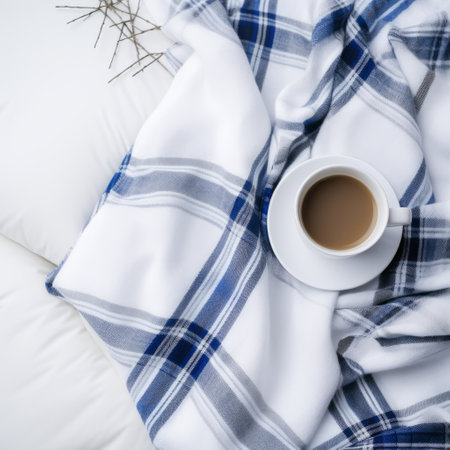 a cup of coffee sits on a plaid cloth, featuring a soft and dreamy atmosphere with flowing fabrics in light navy and light gray. the aurorapunk style adds an exacting precision to the scene, while the stark contrast between the cup and the organic material of the cloth creates an intriguing visual composition. ai generatedの素材