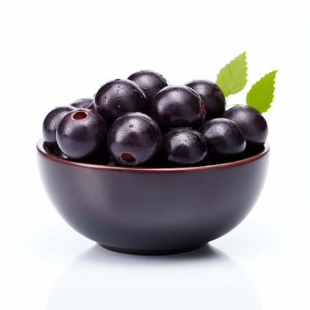 black cherry in a bowl, isolated on a white background. this photo captures the essence of baroque-inspired still lifes with its dark violet hues. shot with a canon af35m, the rounded and matte composition creates a visually striking image. the tightly cropped composition adds to the overall aesthetic. this photo is available under the creative commons attribution license. ai generatedの素材