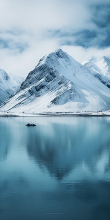 a stunning photo of a fjord in iceland, showcasing the breathtaking nordfjord road leading to the majestic masherbrum mountain. the image captures the beauty of the surrounding park, with the snowy peak of dhaulagiri in the distance. the animated gif-style adds a unique touch, while the tamron 24-70mm lens perfectly captures the minimalist typography and symmetrical arrangement. the photo exudes a fantastic mr. fox-esque vibe,の素材